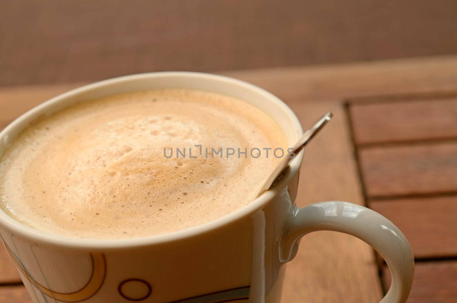 Cup of coffee in front of a window