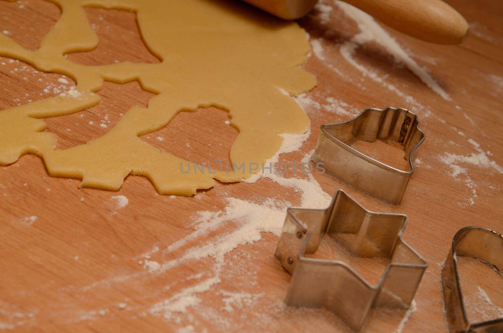 Christmas bakery background with baking tin, cut out some cookies