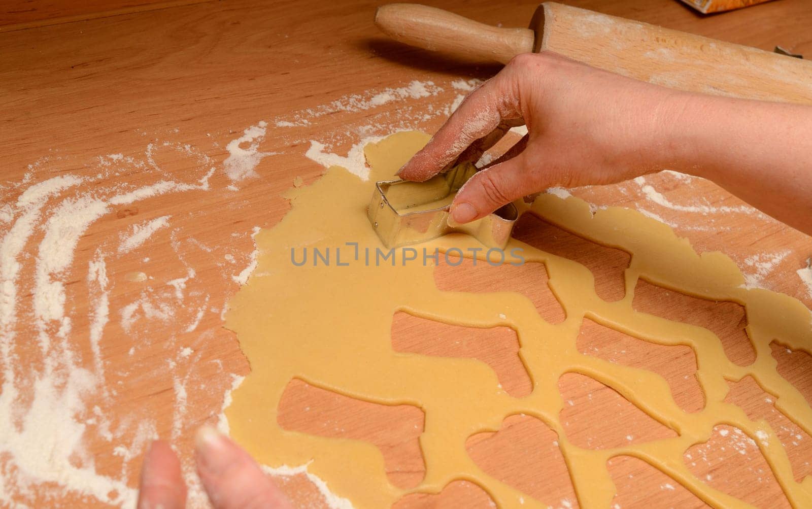Christmas bakery background with baking tin, cut out some cookies