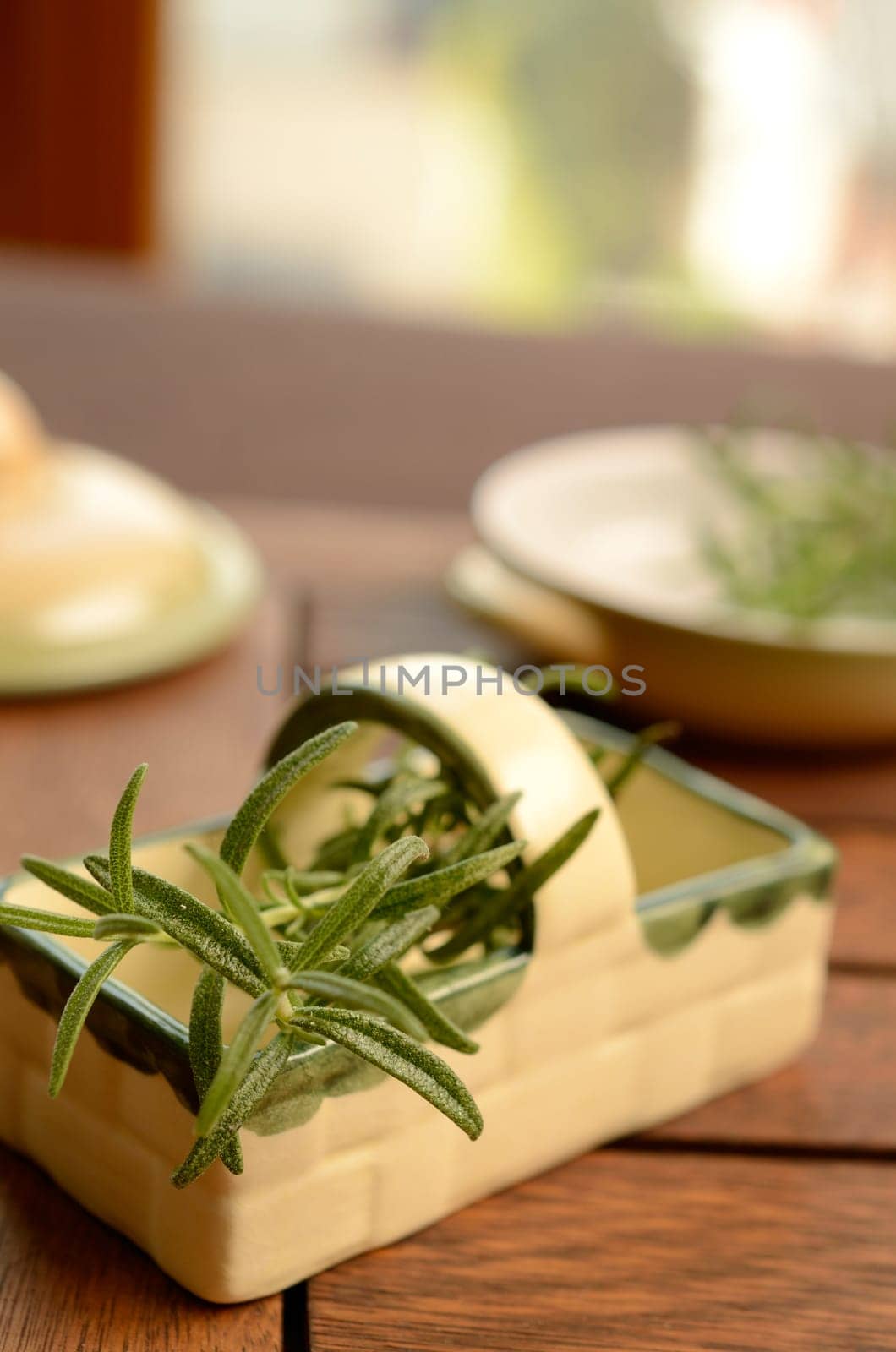 Twig of rosemary on a kitchen table