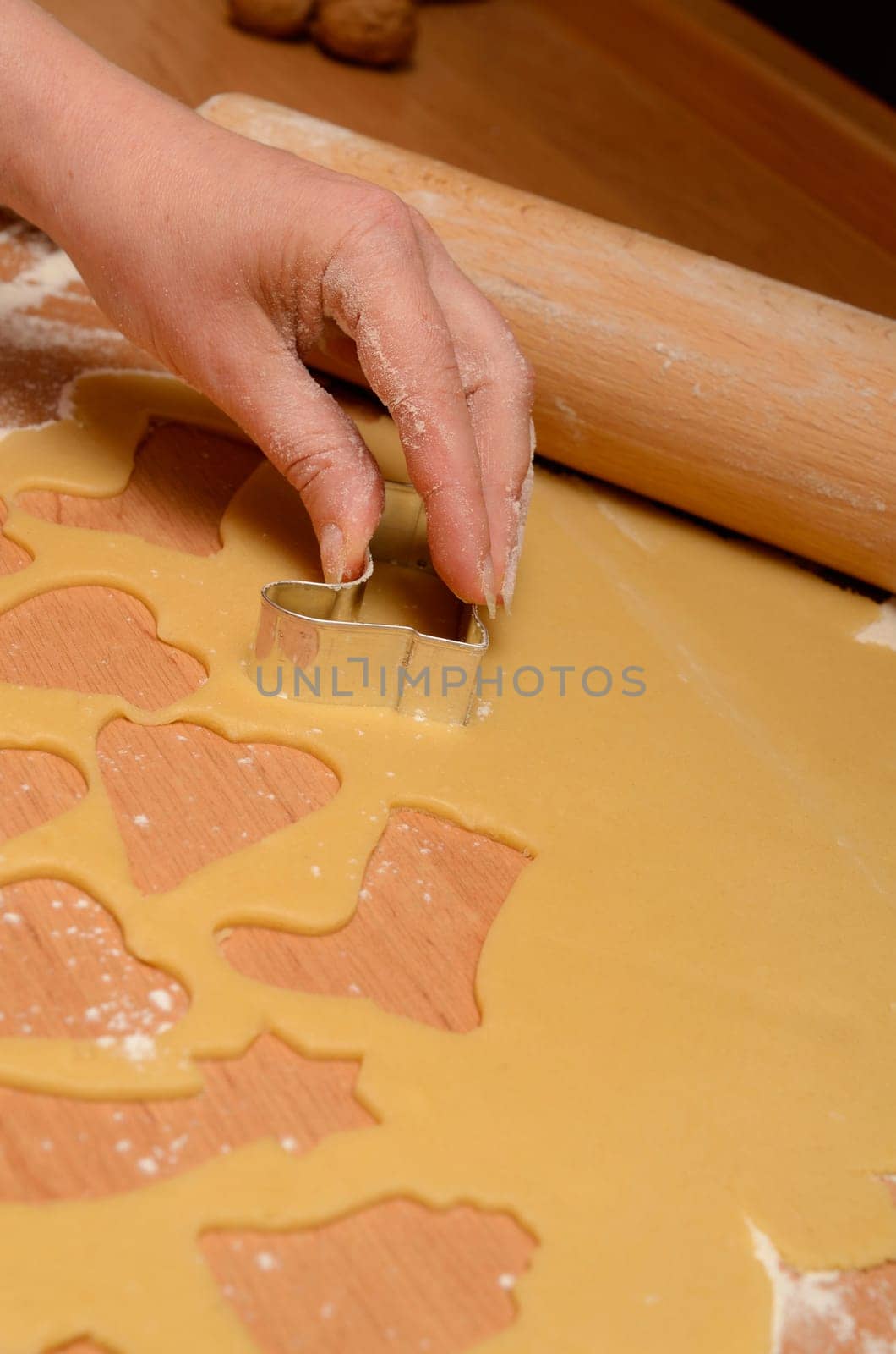Christmas bakery background with baking tin, cut out some cookies