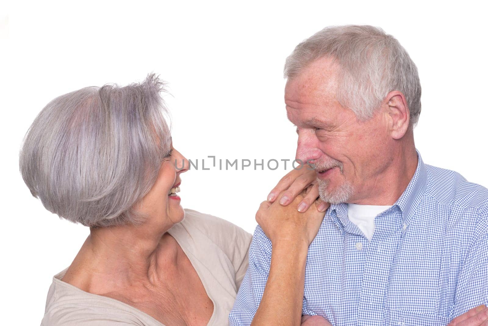 Happy senior couple against a white background