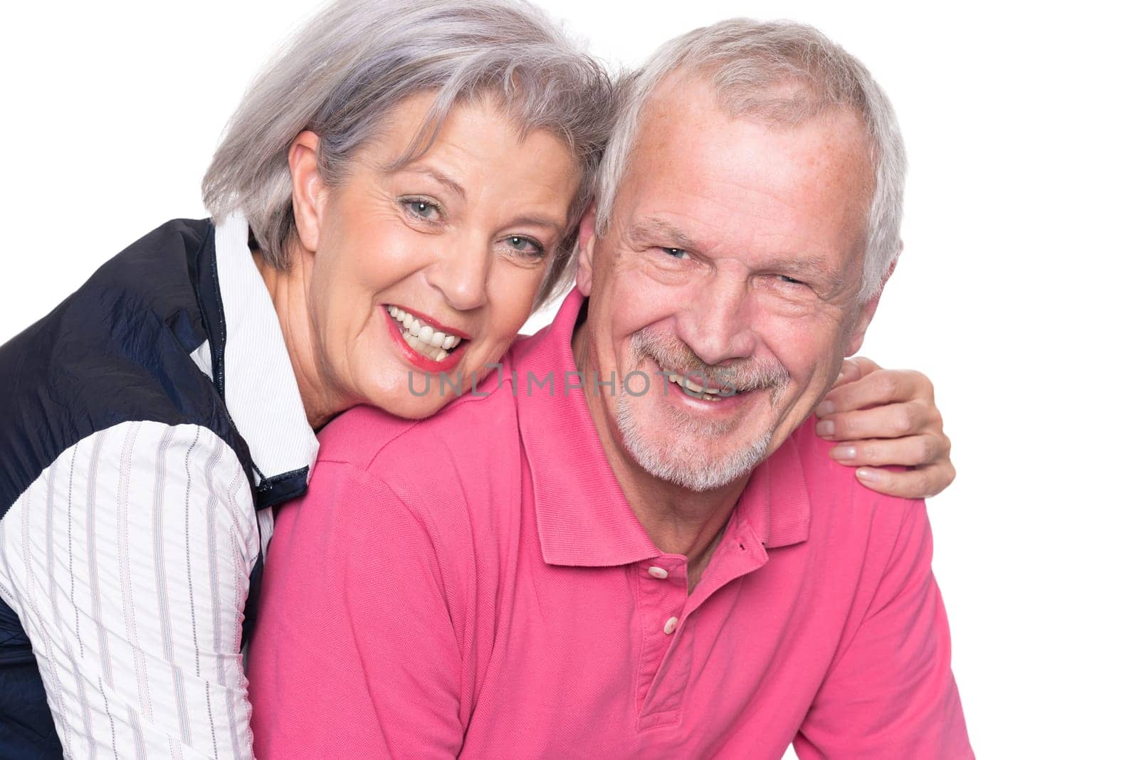 Happy senior couple against a white background