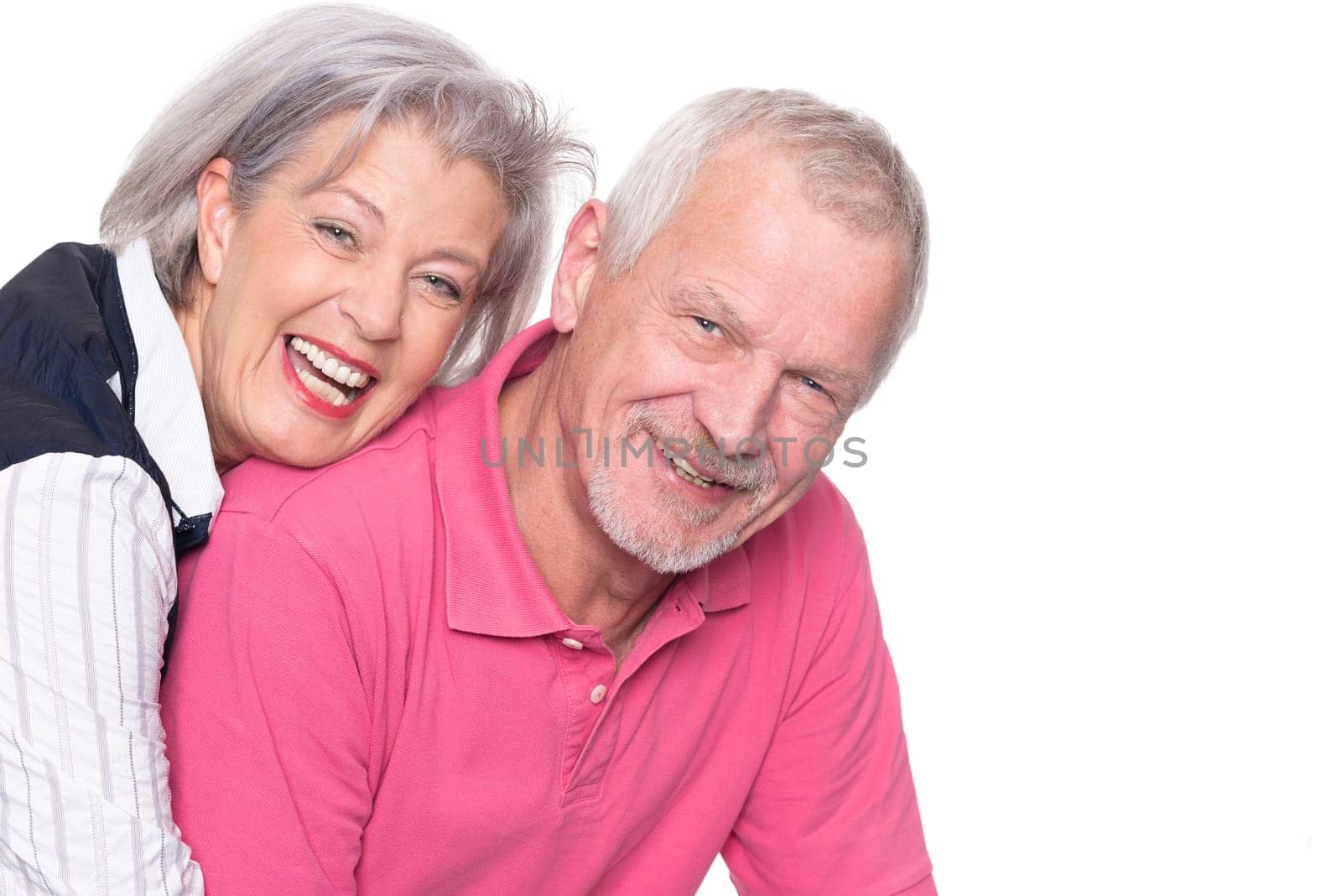 Happy senior couple against a white background