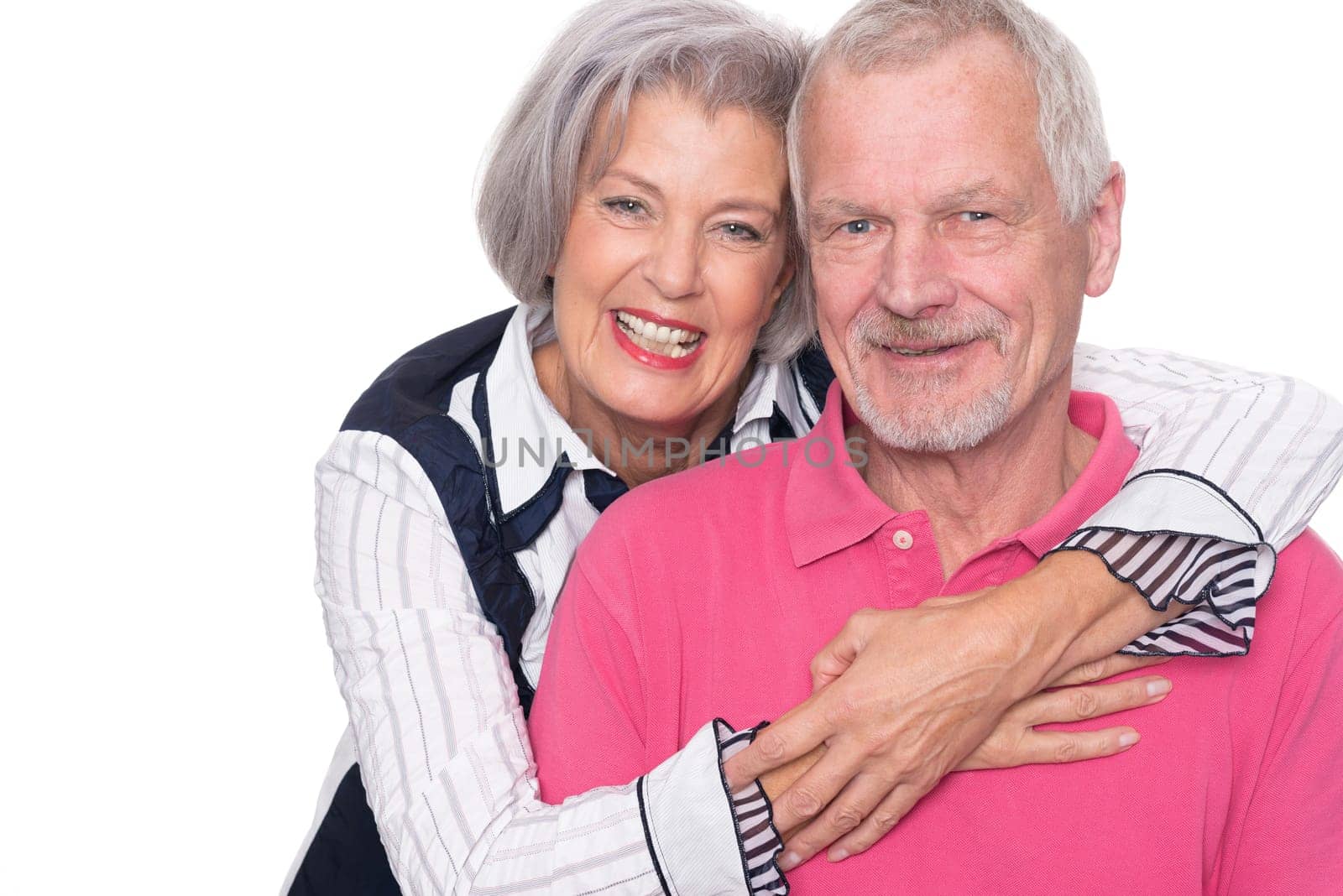 Happy senior couple against a white background