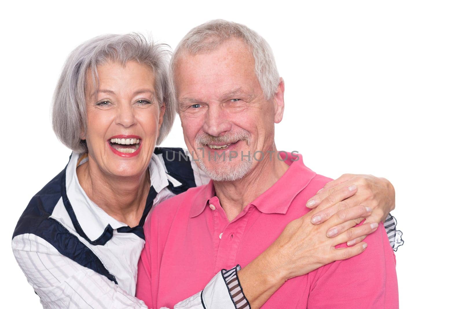 Happy senior couple against a white background