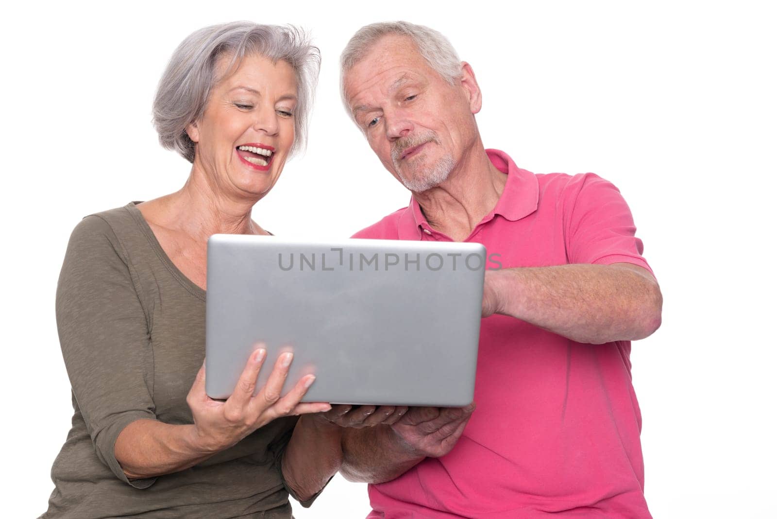 Senior couple with computer against a white background