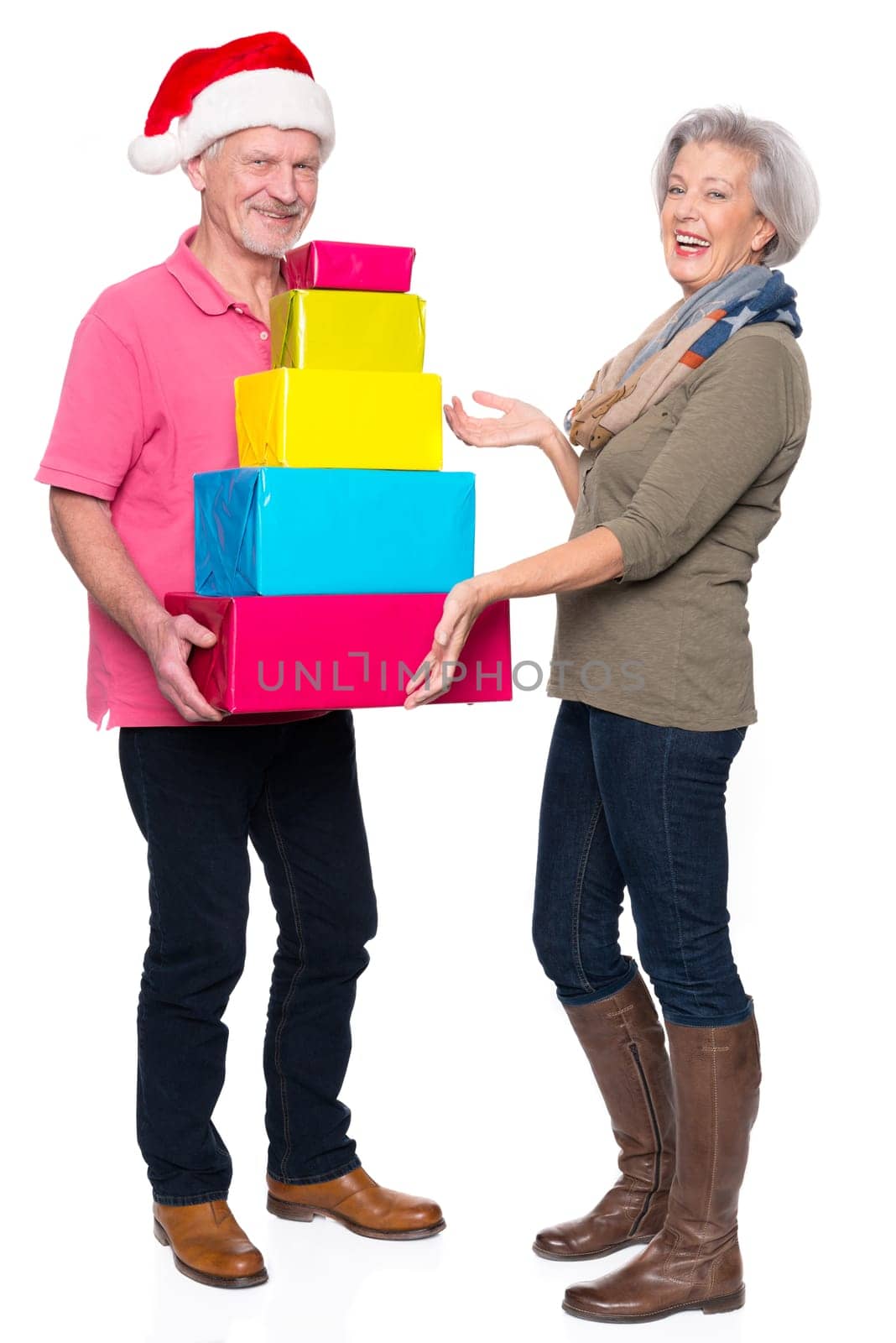 Active seniors with gifts against a white background
