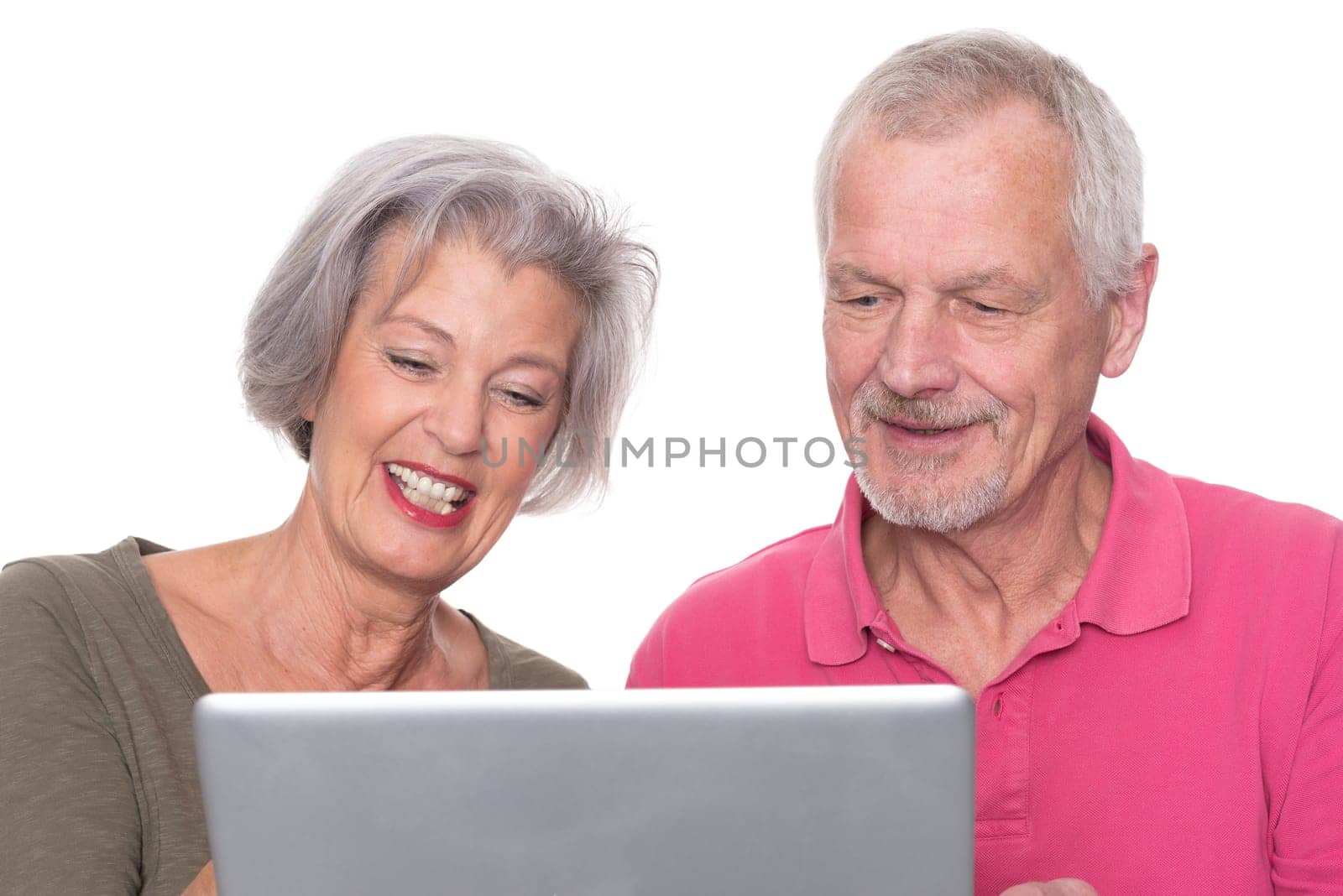 Senior couple with computer against a white background