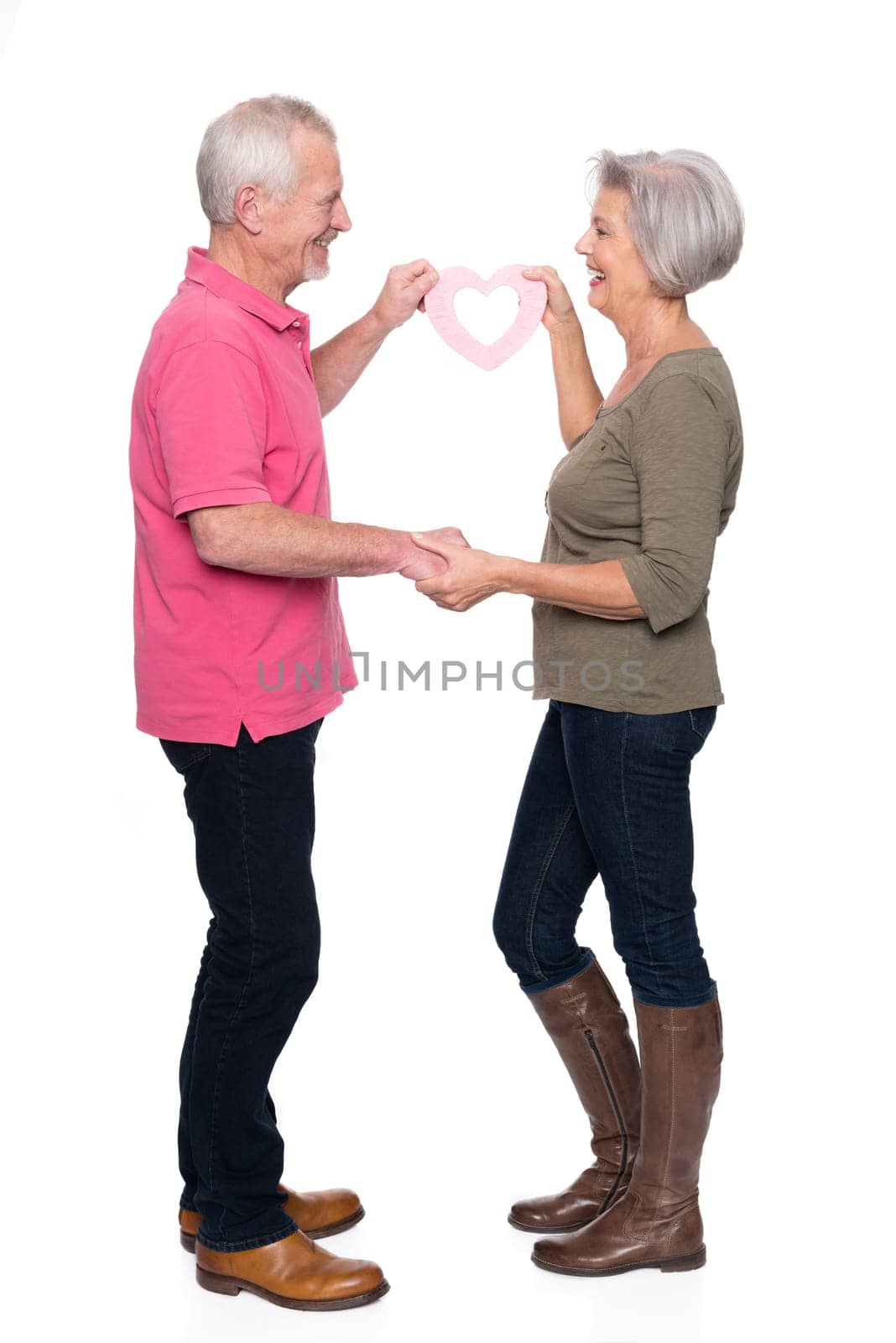 Seniors with a heart against a white background