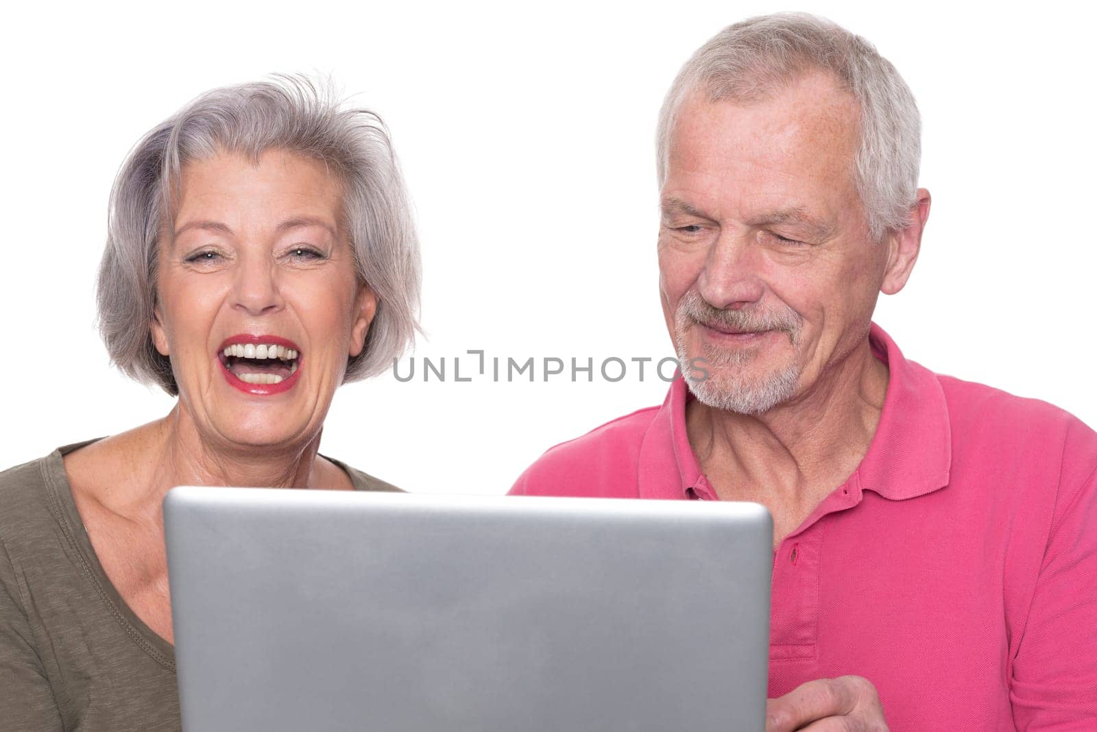 Senior couple with computer against a white background
