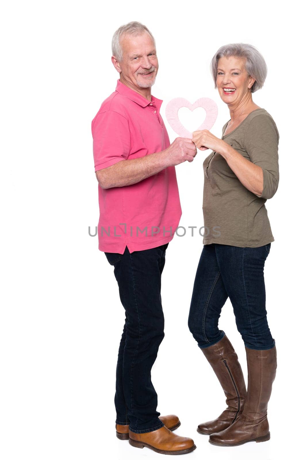Seniors with a heart against a white background