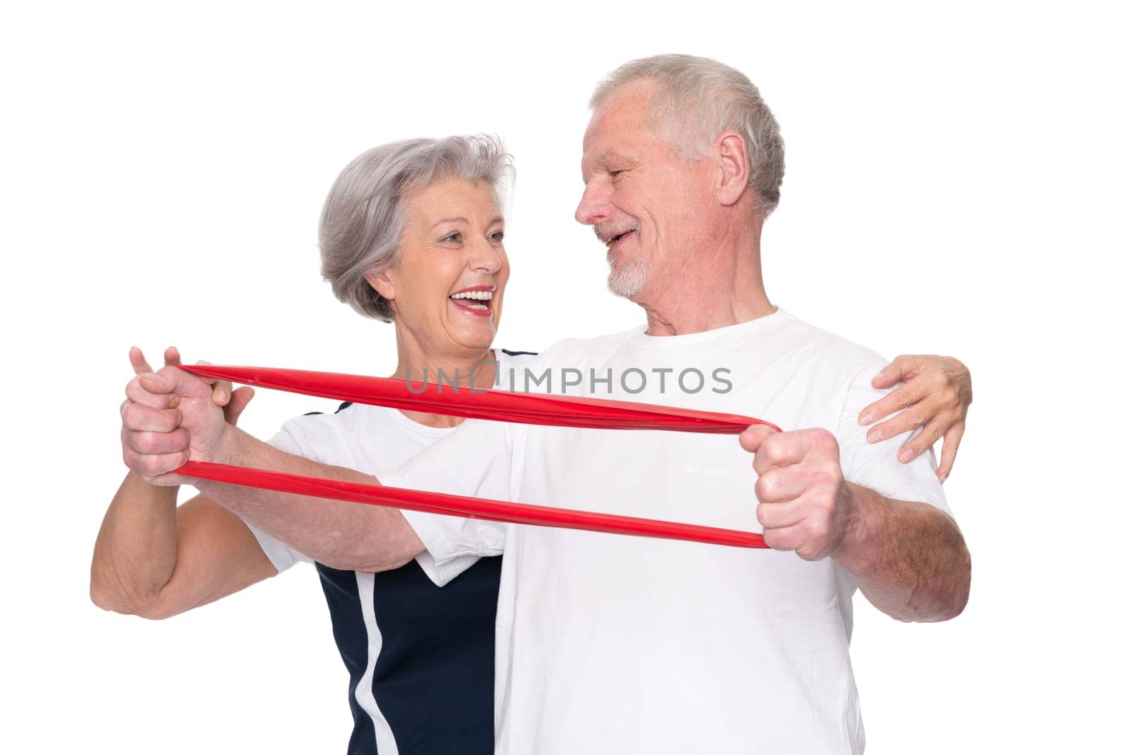 Sporty senior couple against a white background