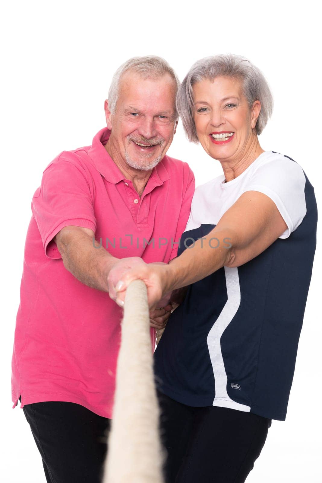 Sporty senior couple against a white background