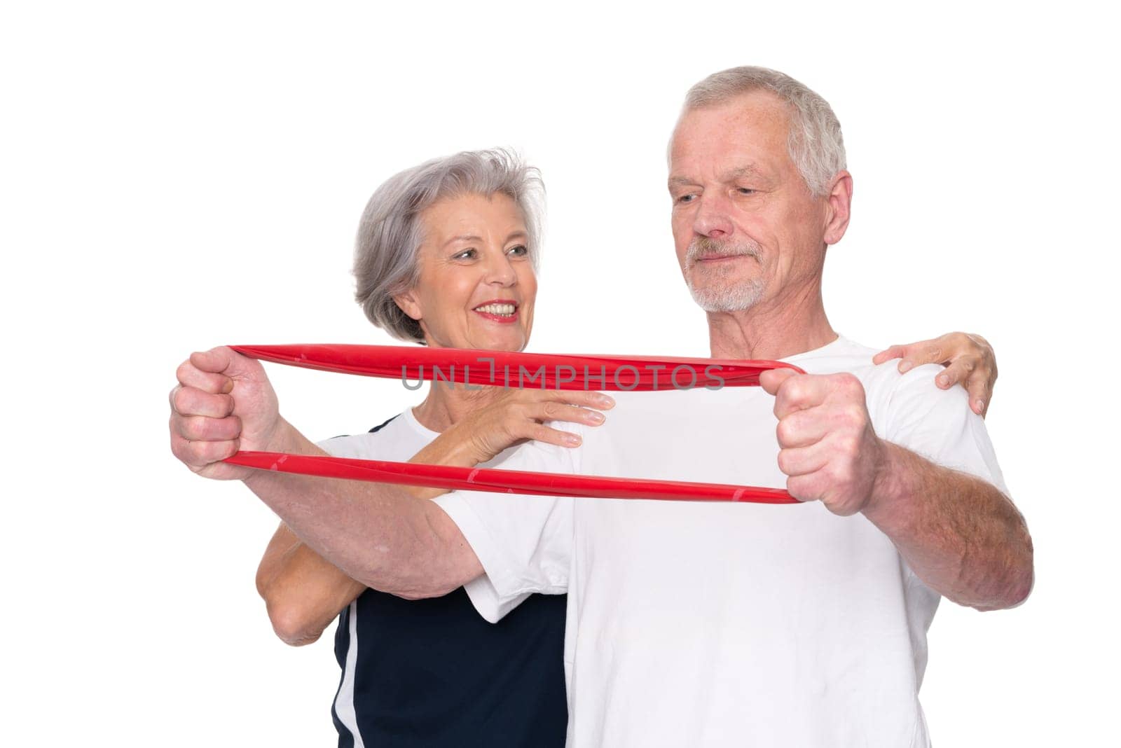 Sporty senior couple against a white background
