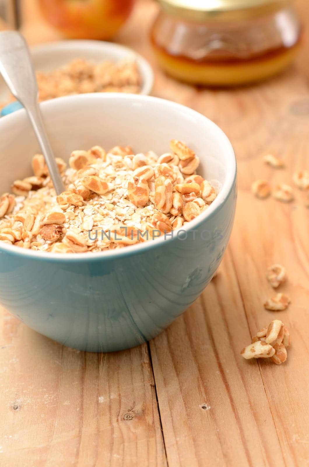 Healthy breakfast with oat flakes and honey flavoured spelt