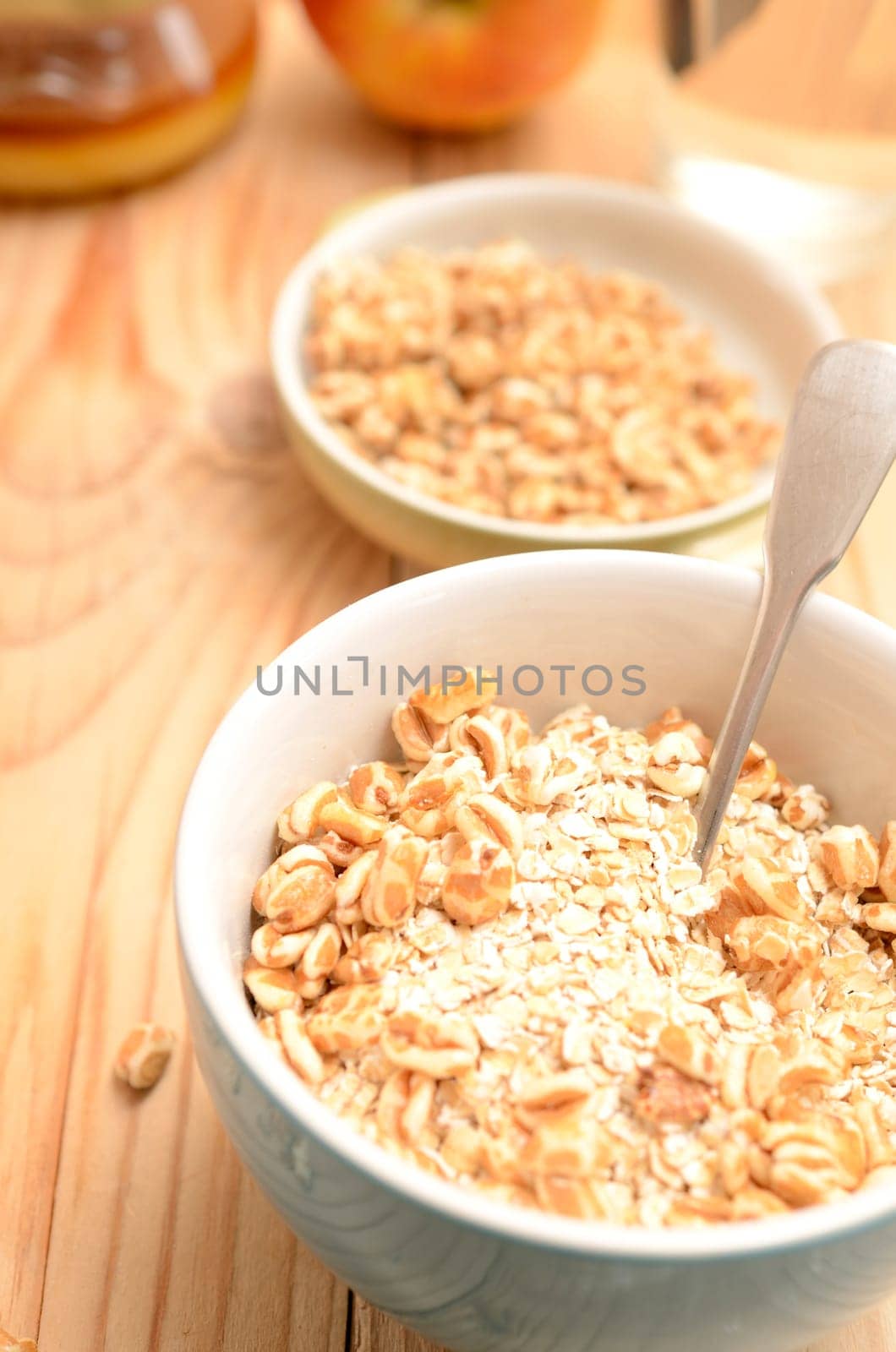 Healthy breakfast with oat flakes and honey flavoured spelt