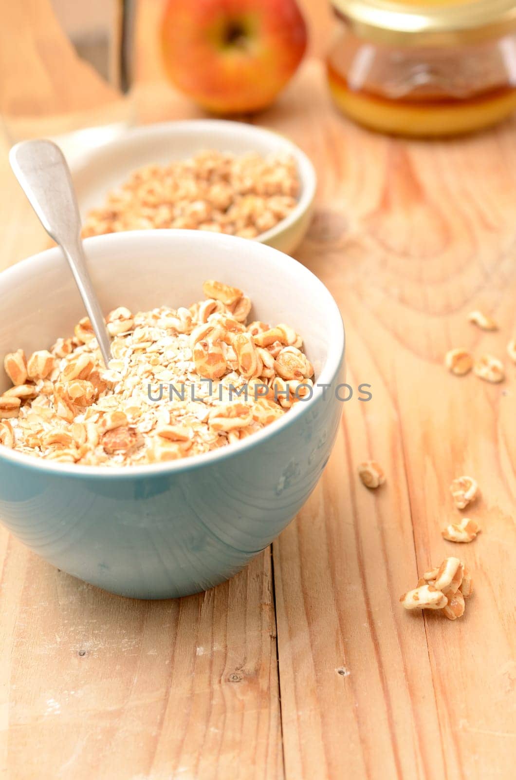 Healthy breakfast with oat flakes and honey flavoured spelt