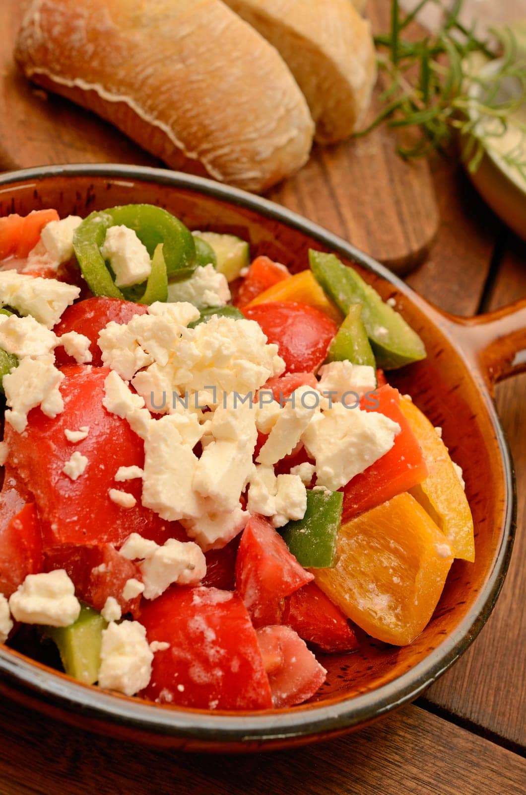 Mediterranean salad in an old ceramic bowl