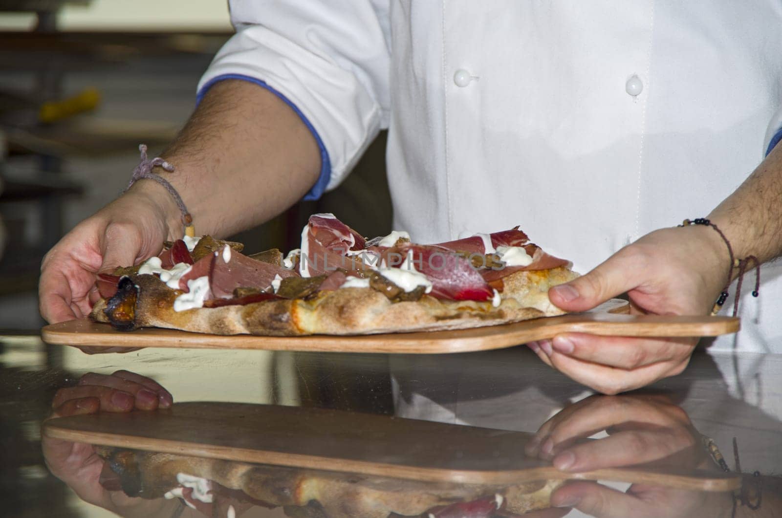 Whites pizzas cooked and stuffed with bacon, artichokes,ham and mozzarella cheese