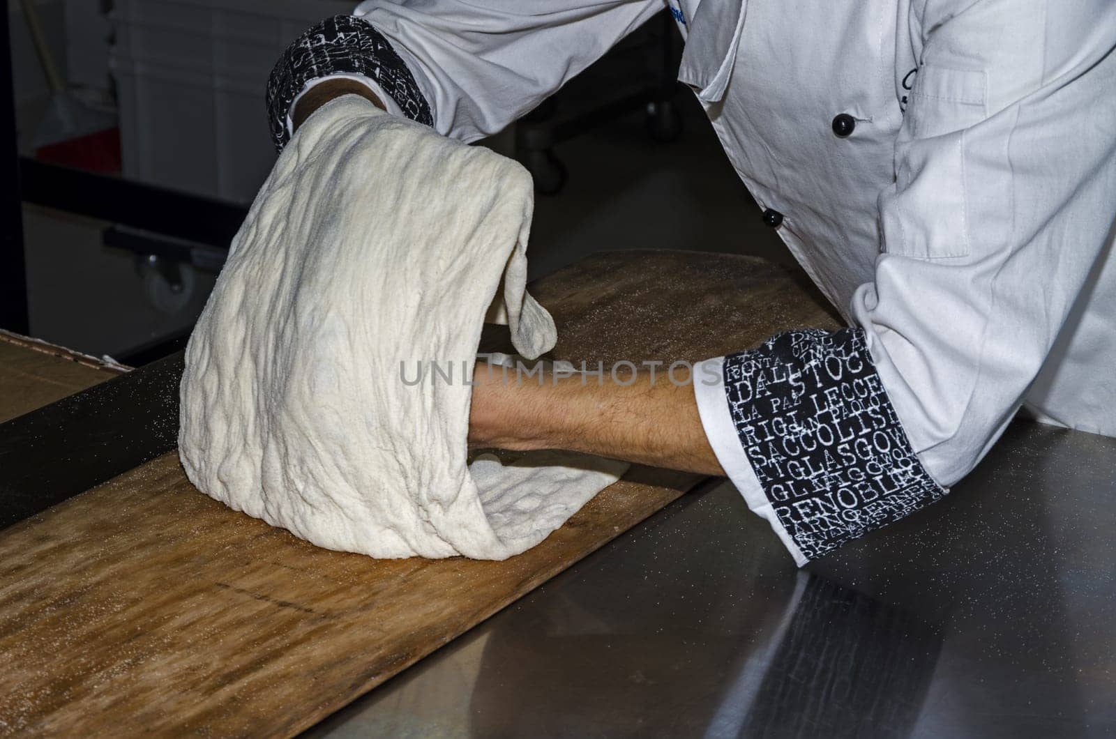 Handling, working and cooking pizza dough with shovel