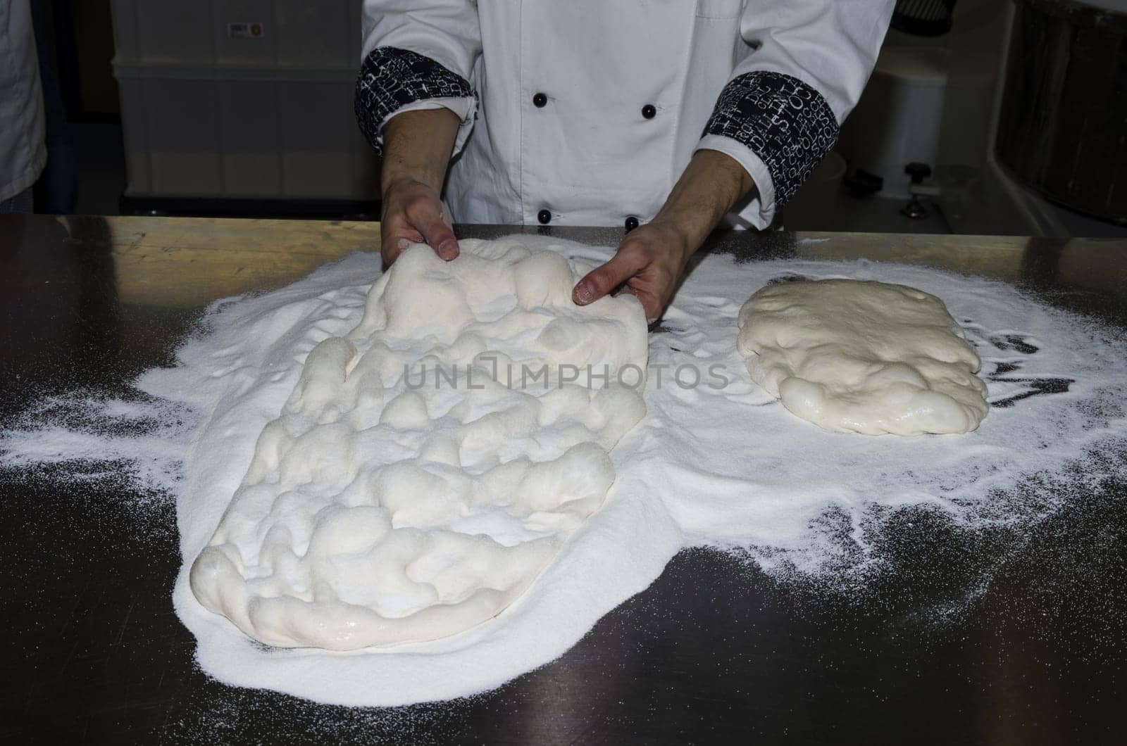 Handling, working and cooking pizza dough with shovel