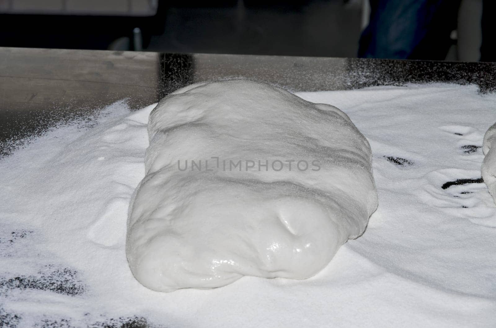 Handling, working and cooking pizza dough with shovel