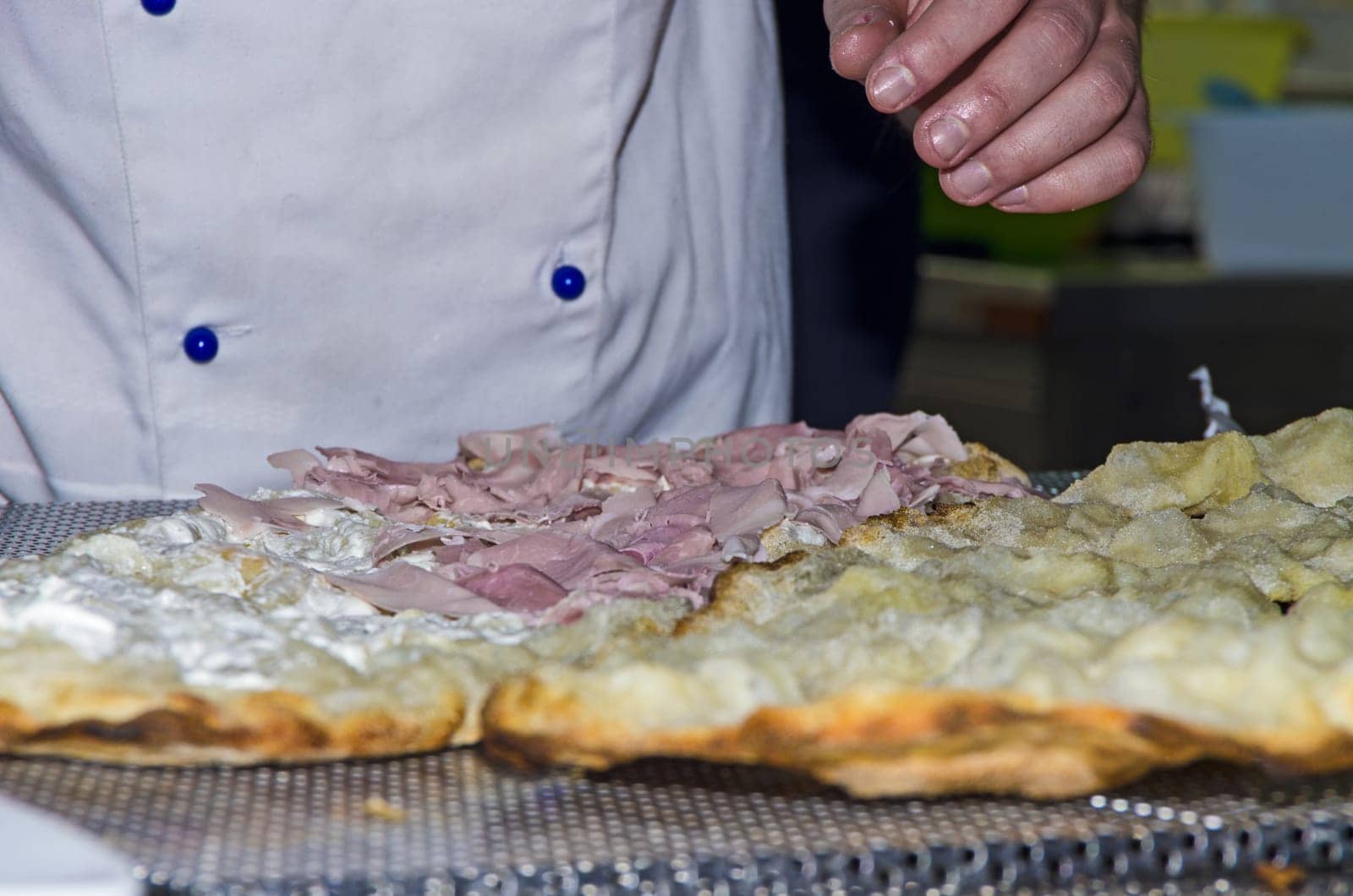 Whites pizzas cooked and stuffed with bacon, artichokes,ham and mozzarella cheese