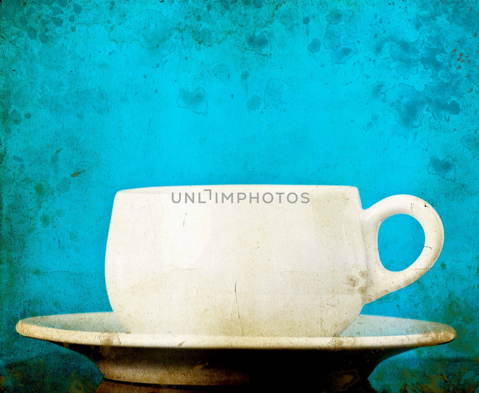 White coffee cup on vintage background