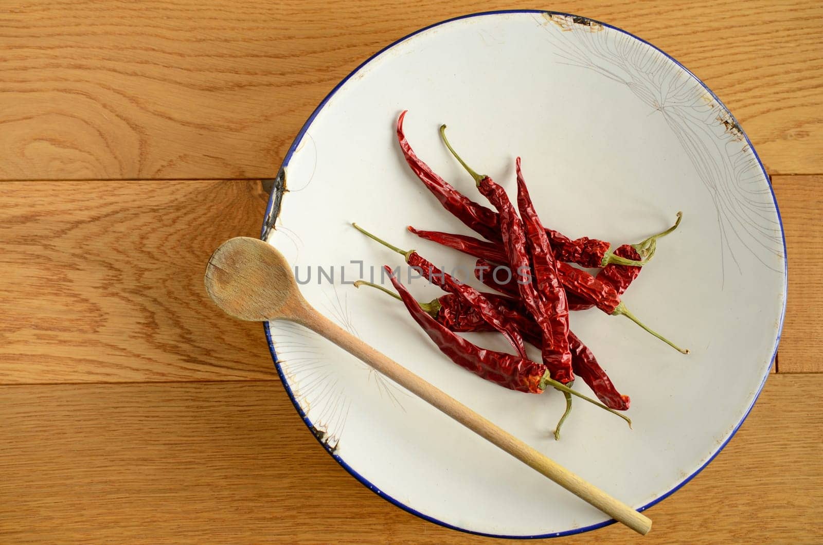 Dried chilies on an old used plate