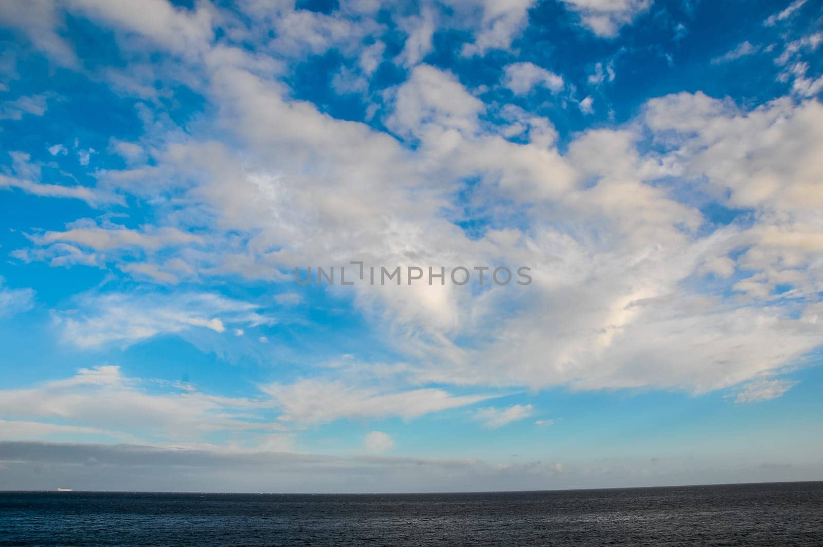 Cloudscape, Colored Clouds at Sunset near the Ocean