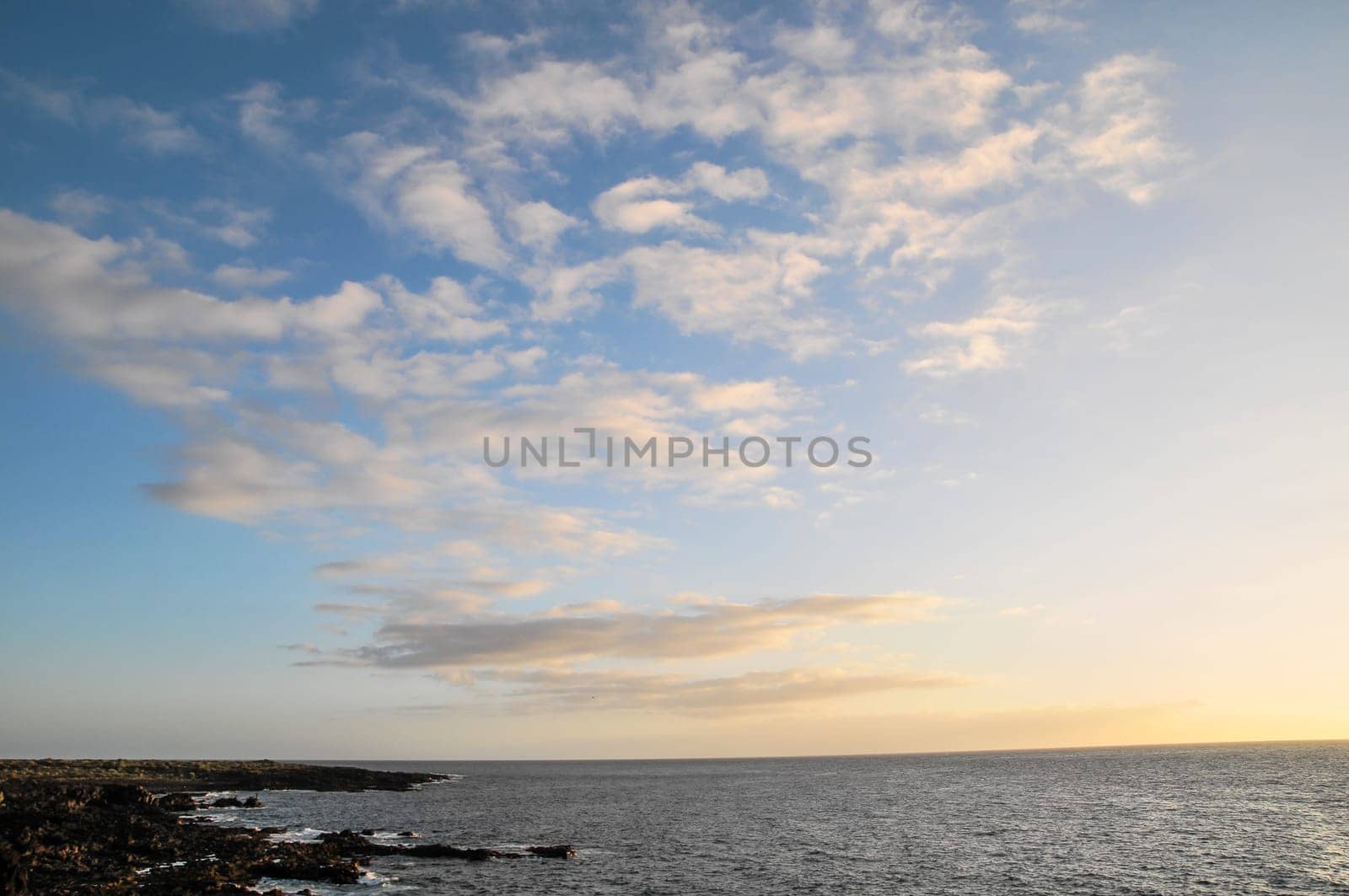 Cloudscape, Colored Clouds at Sunset near the Ocean