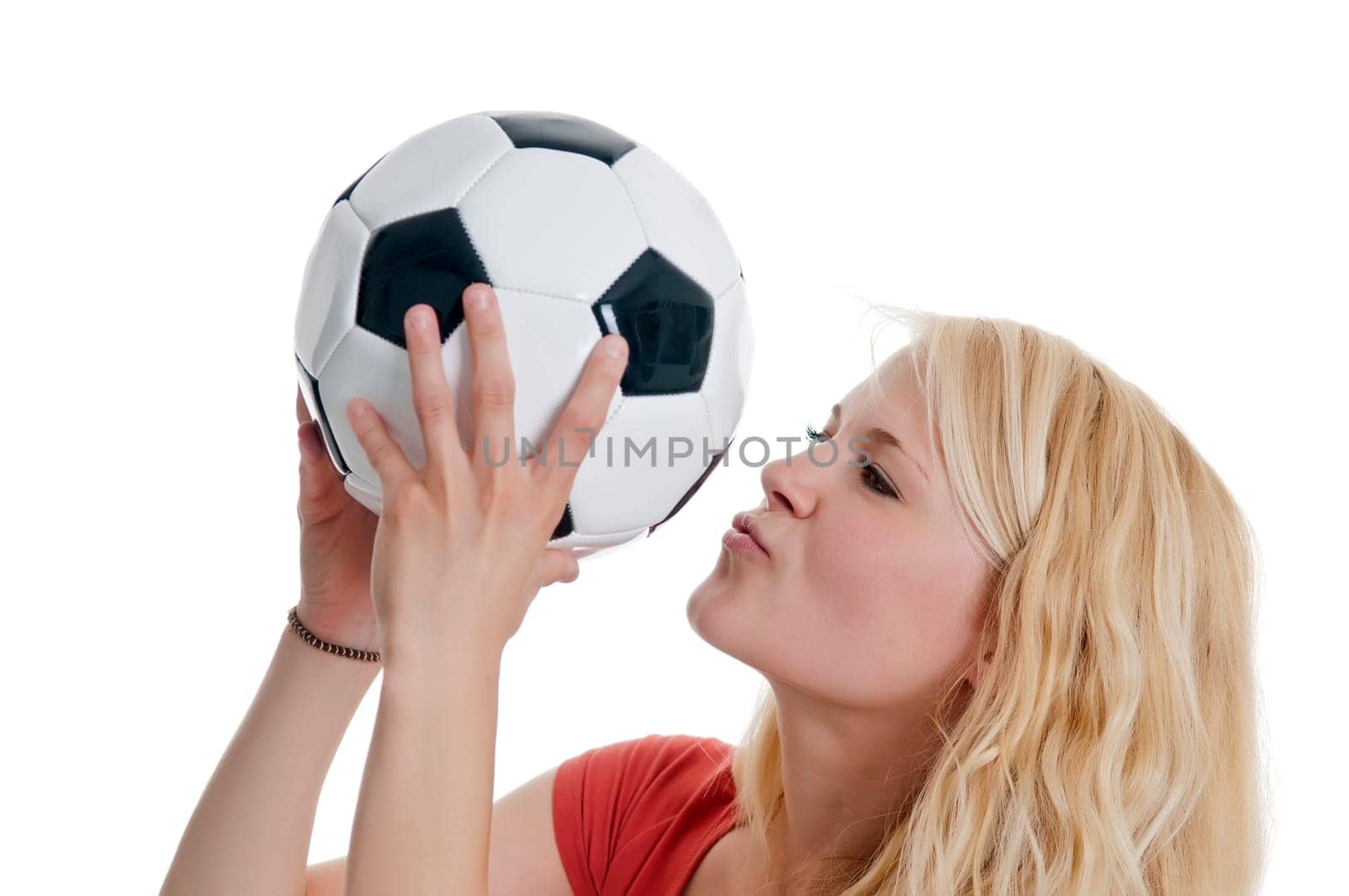 Woman kisses football