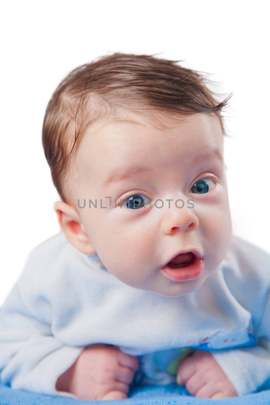Studio portrait of a happy 3 months old baby boy.