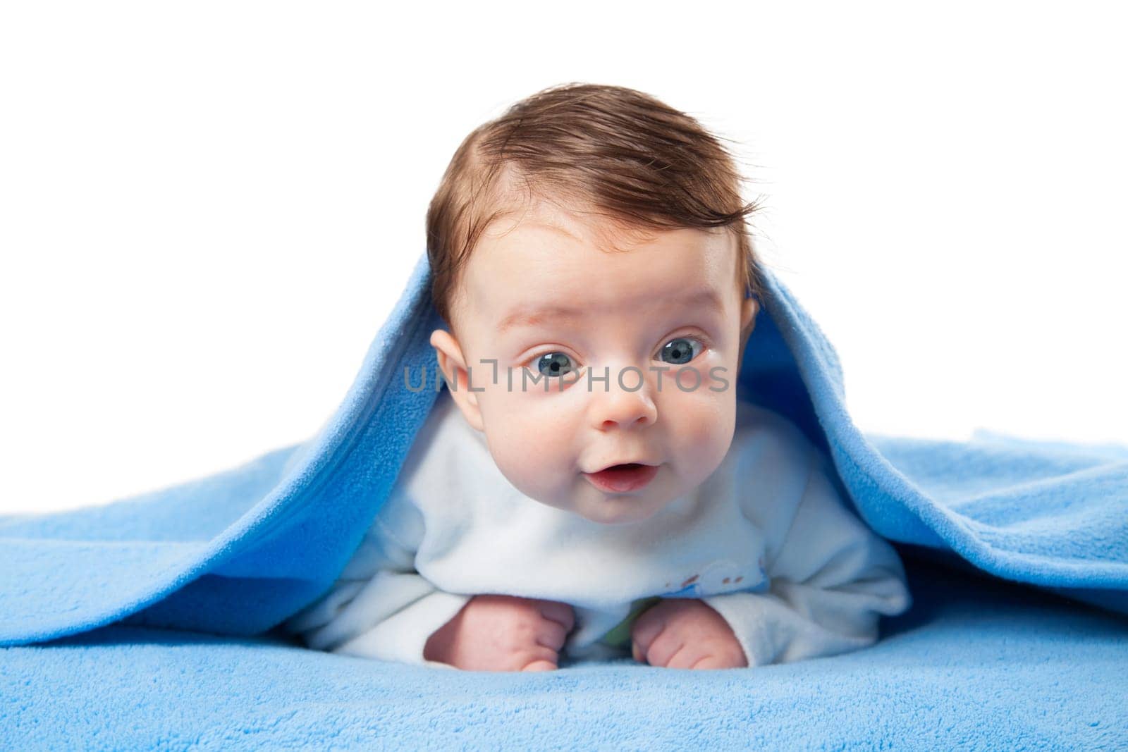 Portrait of a happy 3 months old baby boy under blue blanket.