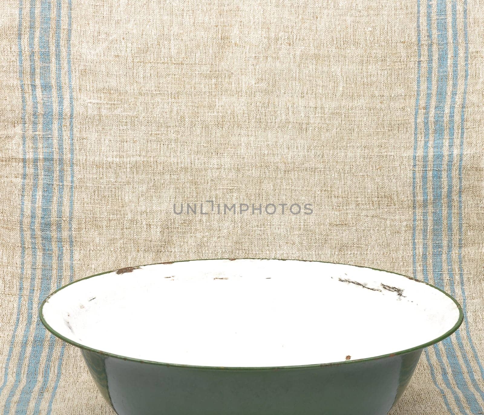 Tin bowl on linen cloth