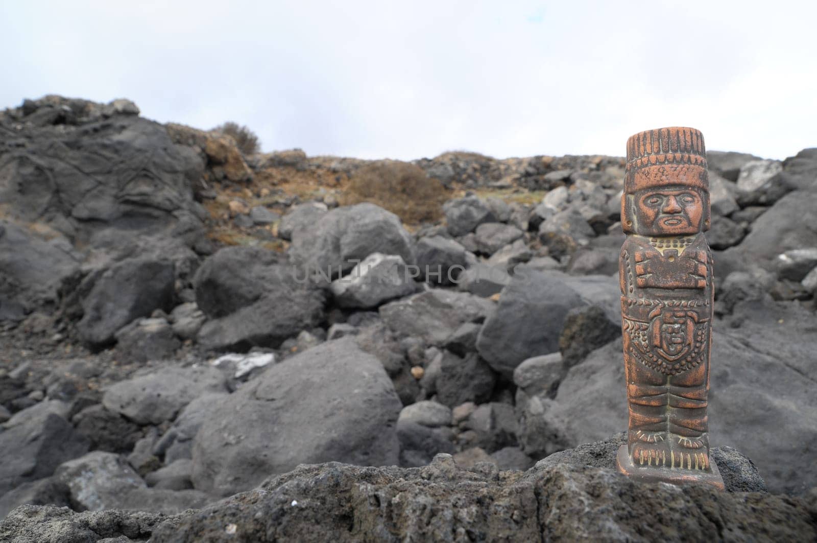 Ancient Maya Statue on the Rocks near Ocean