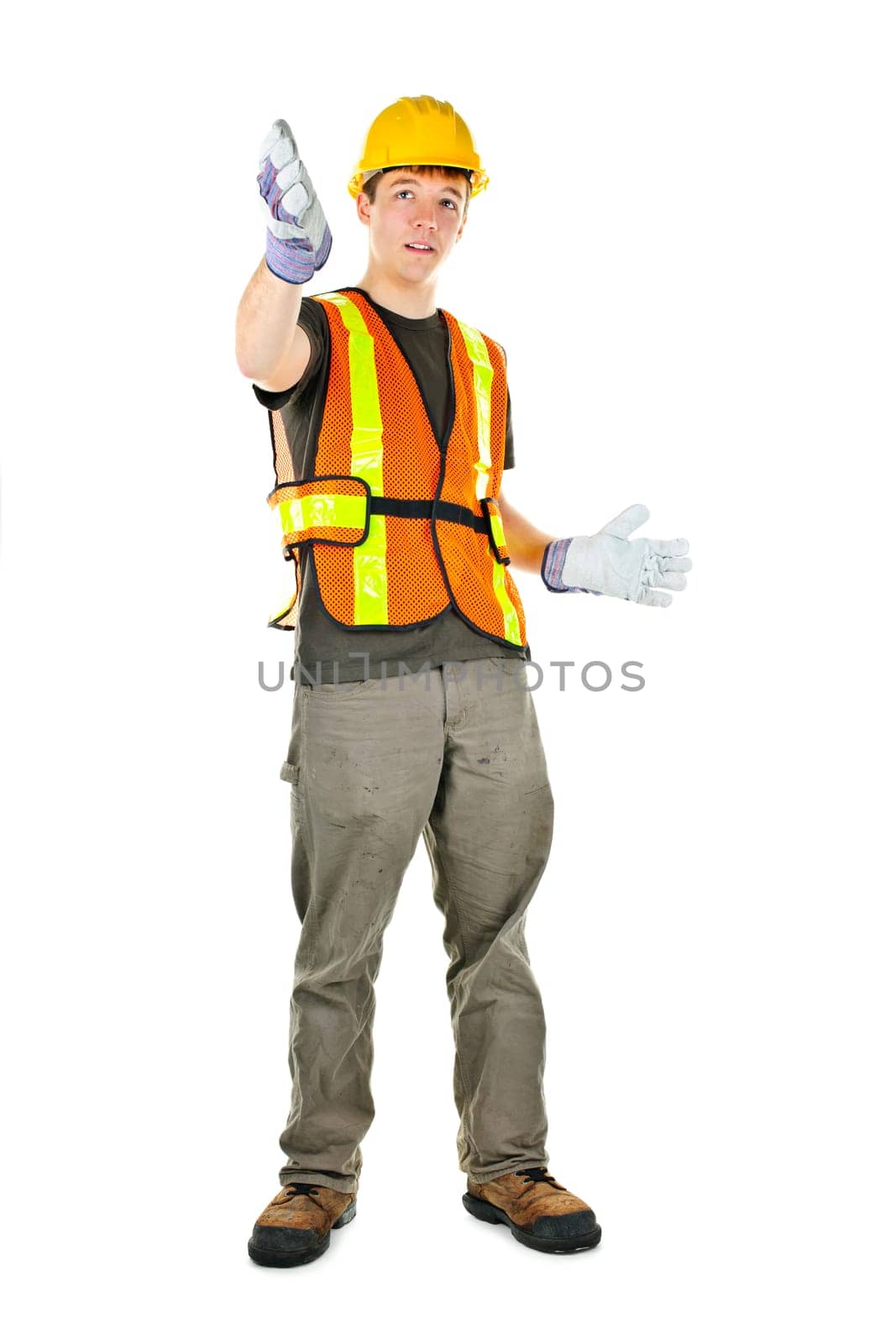Male construction worker directing with hand signals in vest and hard hat