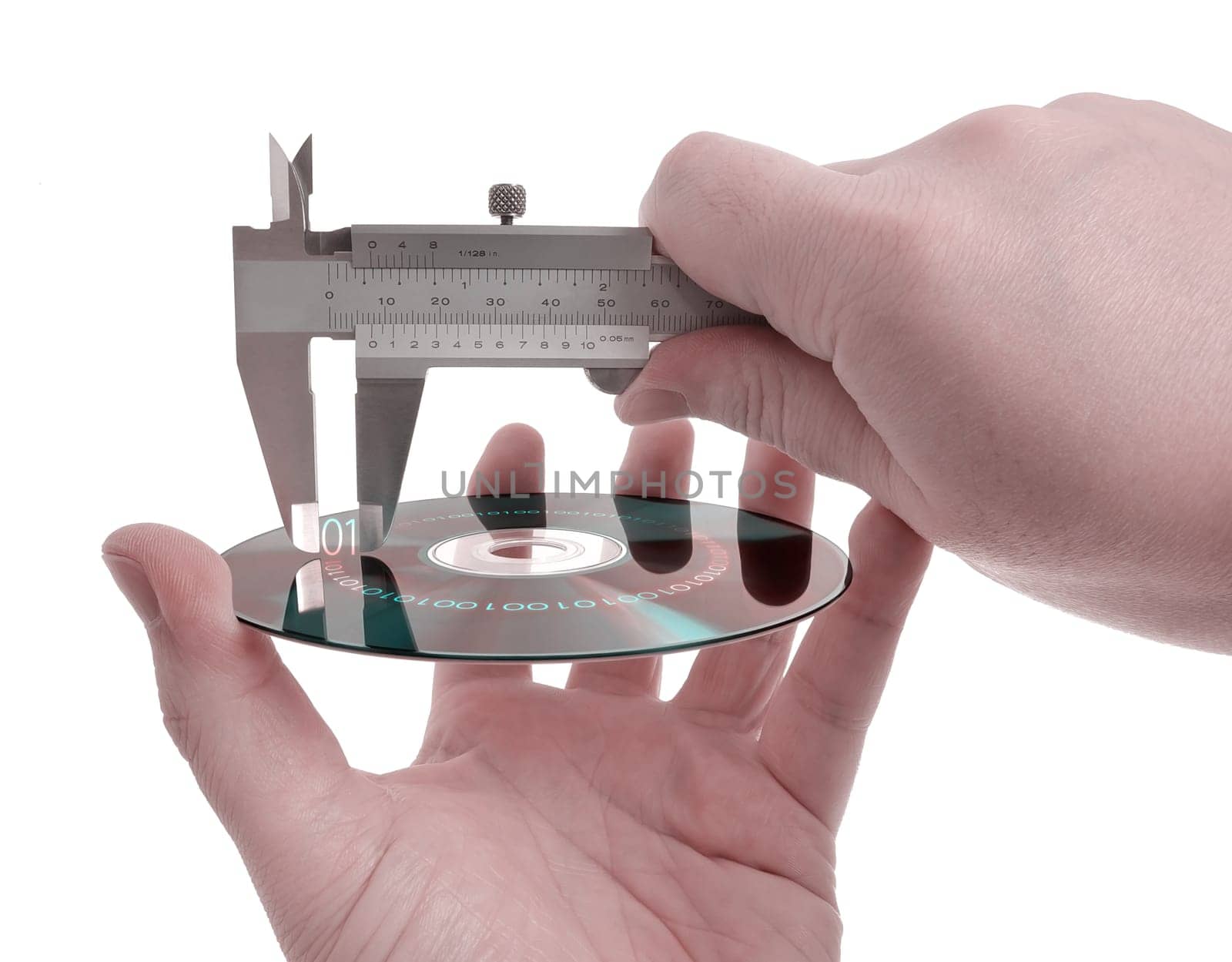 Measuring the size of information within the digital media using a caliper. Concept of information storage and compression.