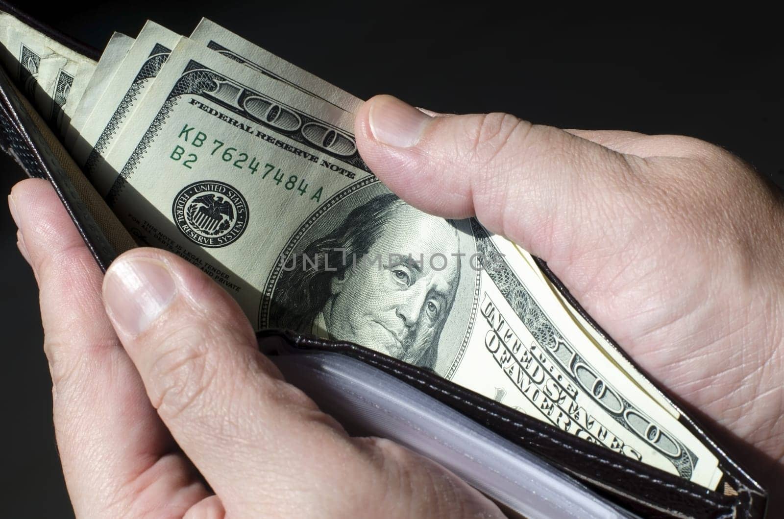 Wallet full of money, concept of wealth.