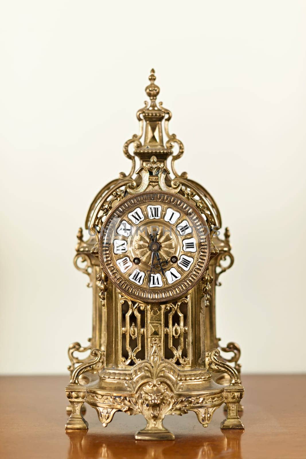 Antique bronze shelf clock with ornate decoration