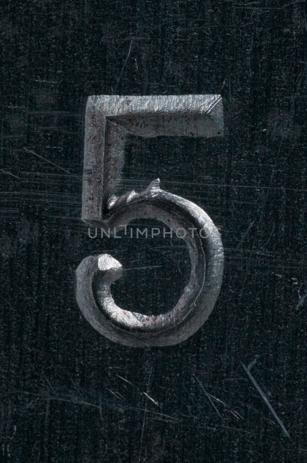 Macro image of a number in metal X