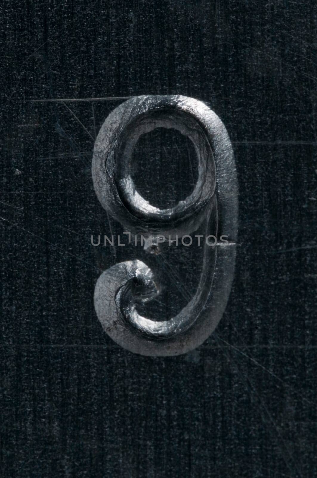 Macro image of a number in metal X