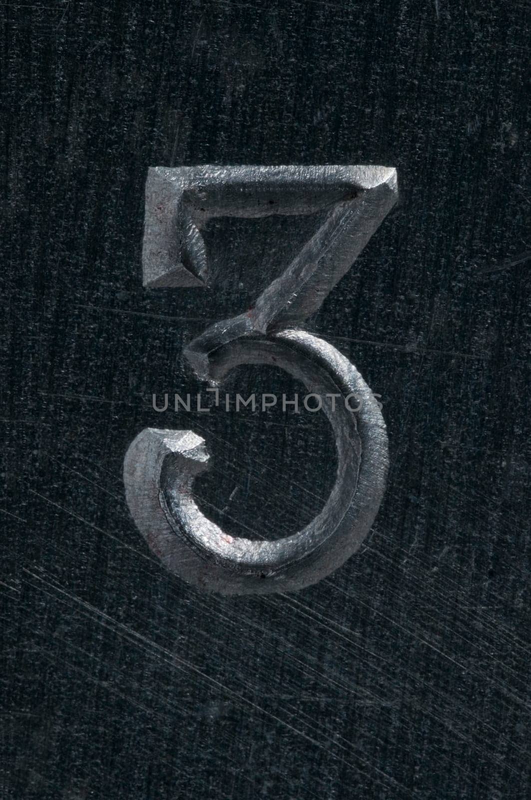 Macro image of a number in metal X
