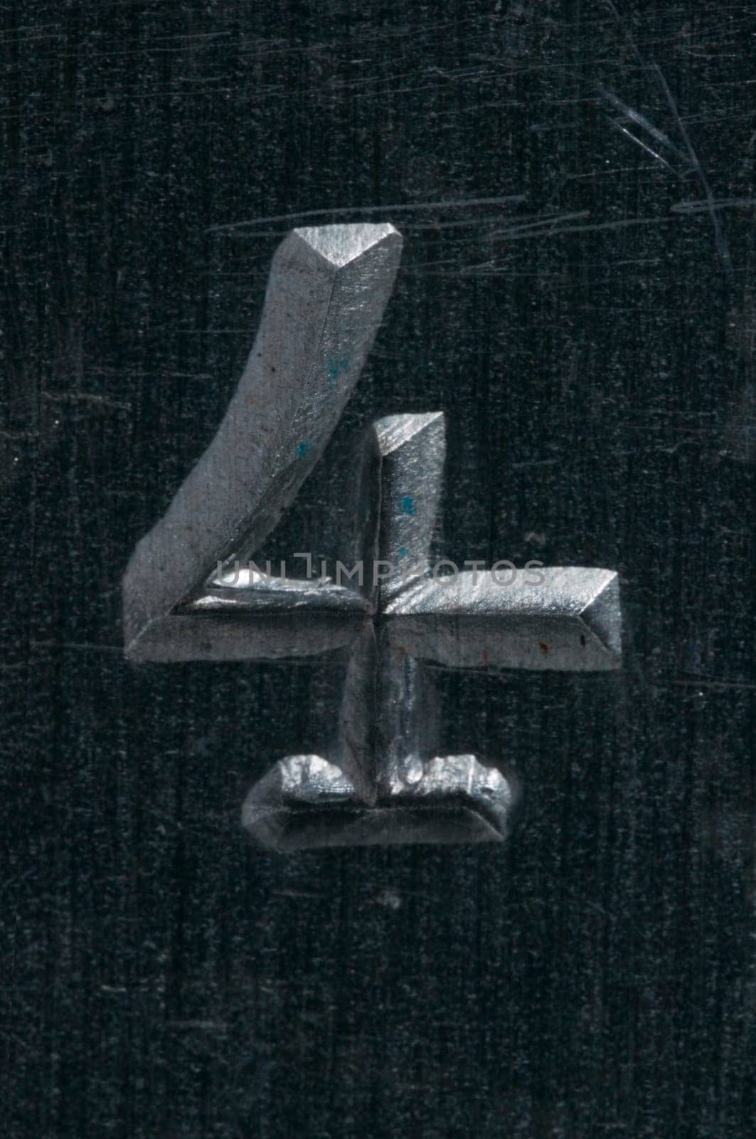 Macro image of a number in metal X