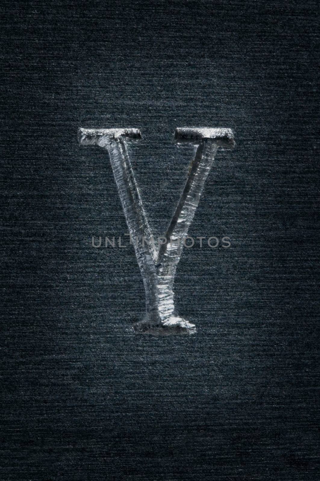 Macro image of the letter "Y"" in metal"