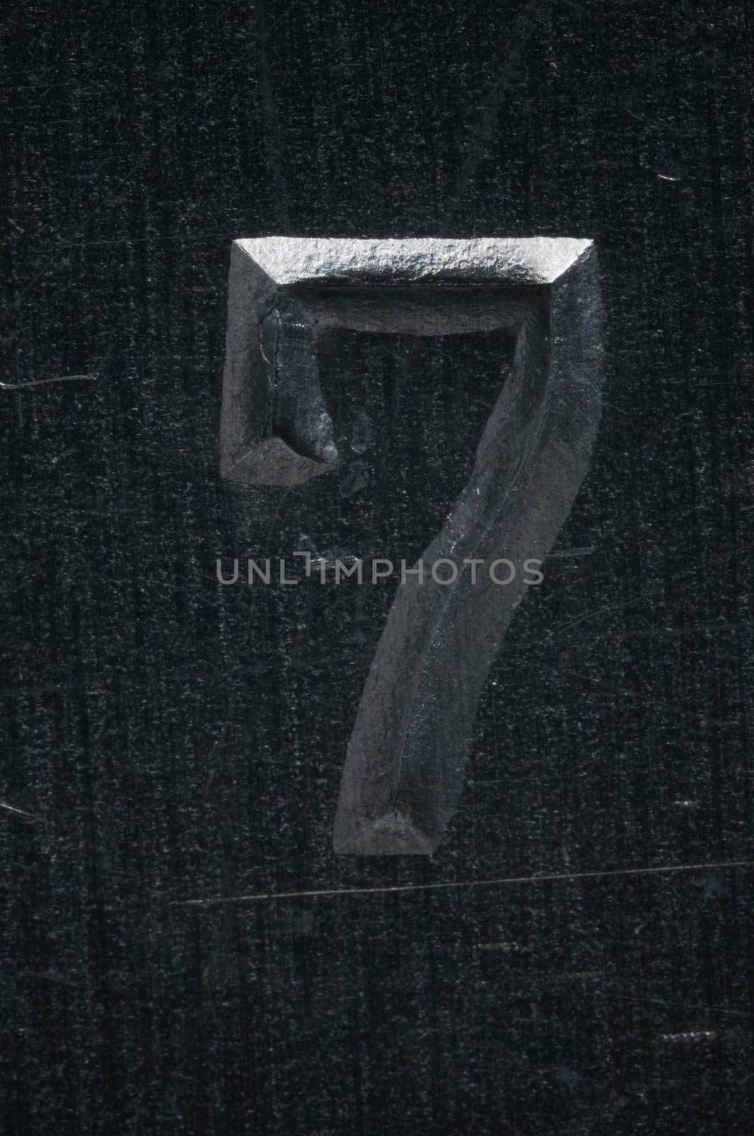 Macro image of a number in metal X
