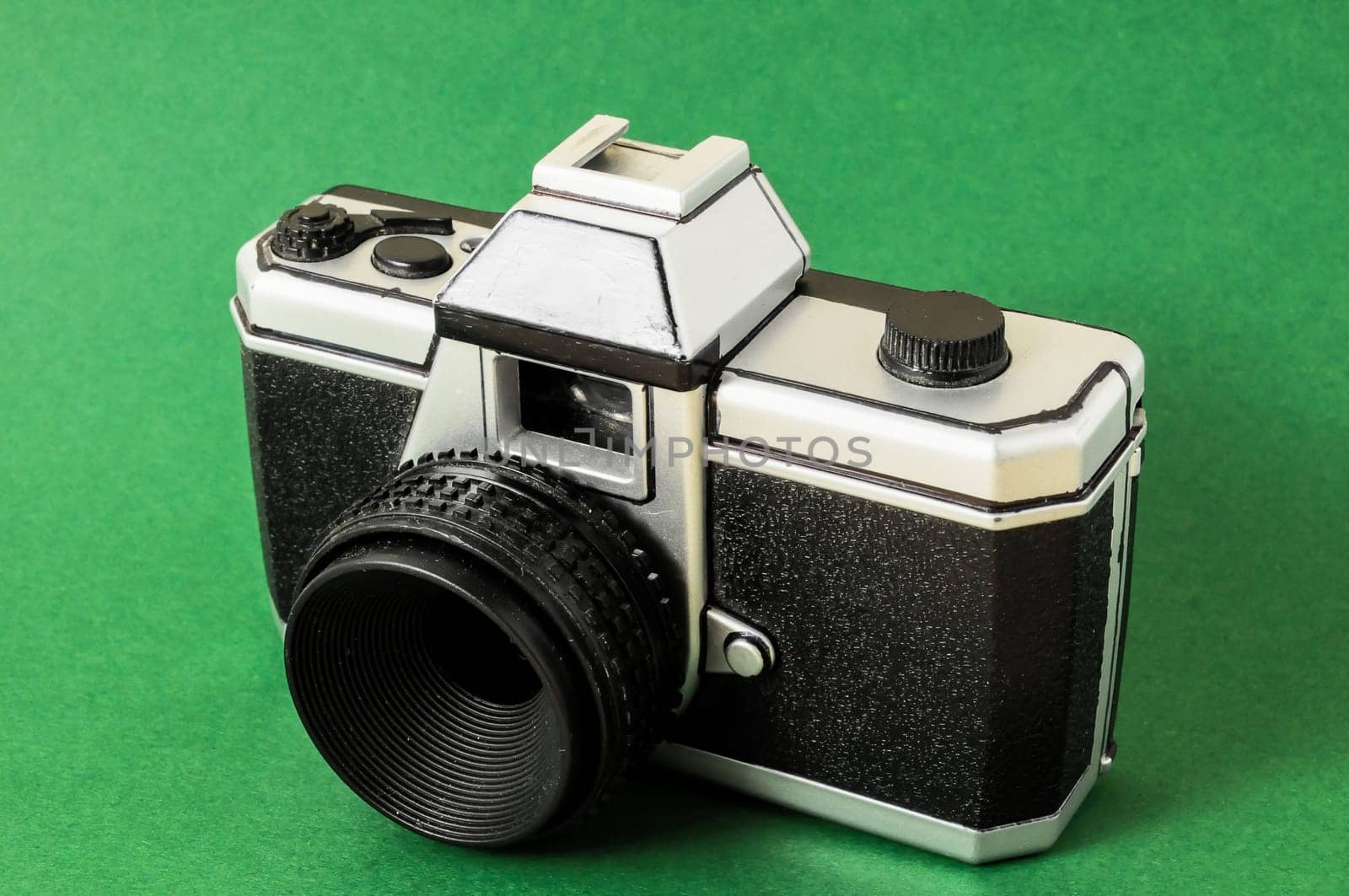 Classic 35mm Plastic Toy Photo Camera on a Colored Background