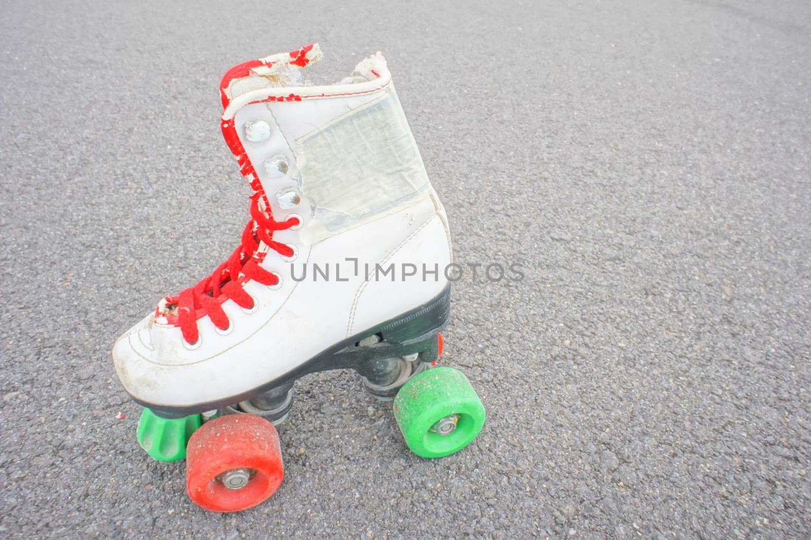 Hdr Picture of Old Vintage White Skate Boot on the Asphalt Sterret