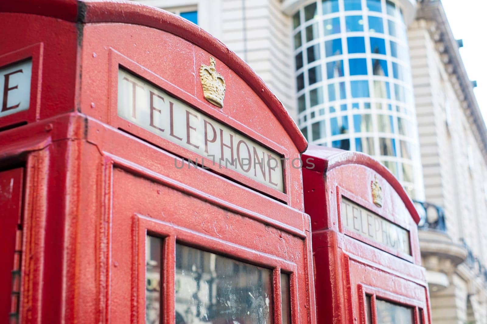 Detail of old red telephone booth in London, UK